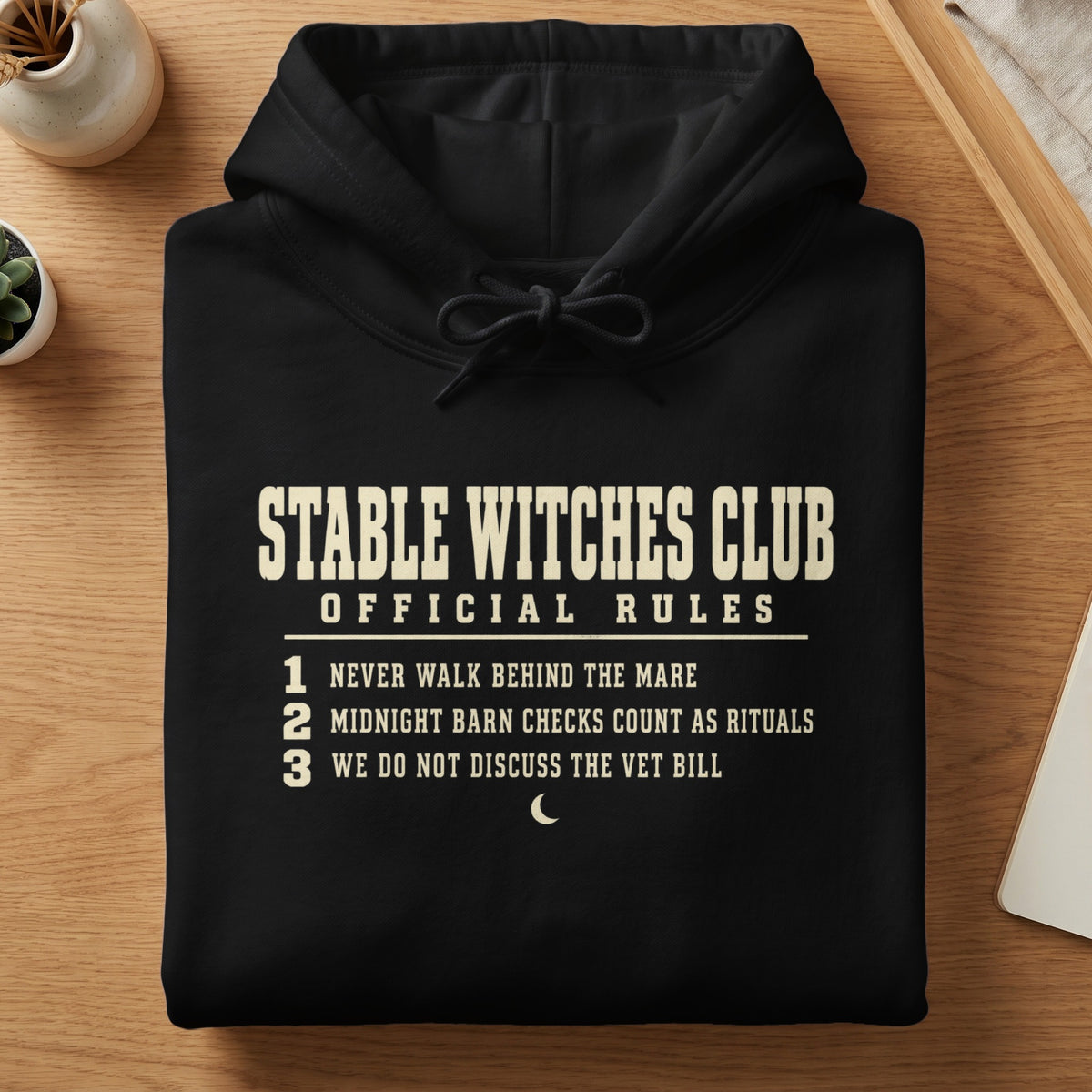 Black hoodie with "Stable Witches Club Official Rules" and three numbered rules.