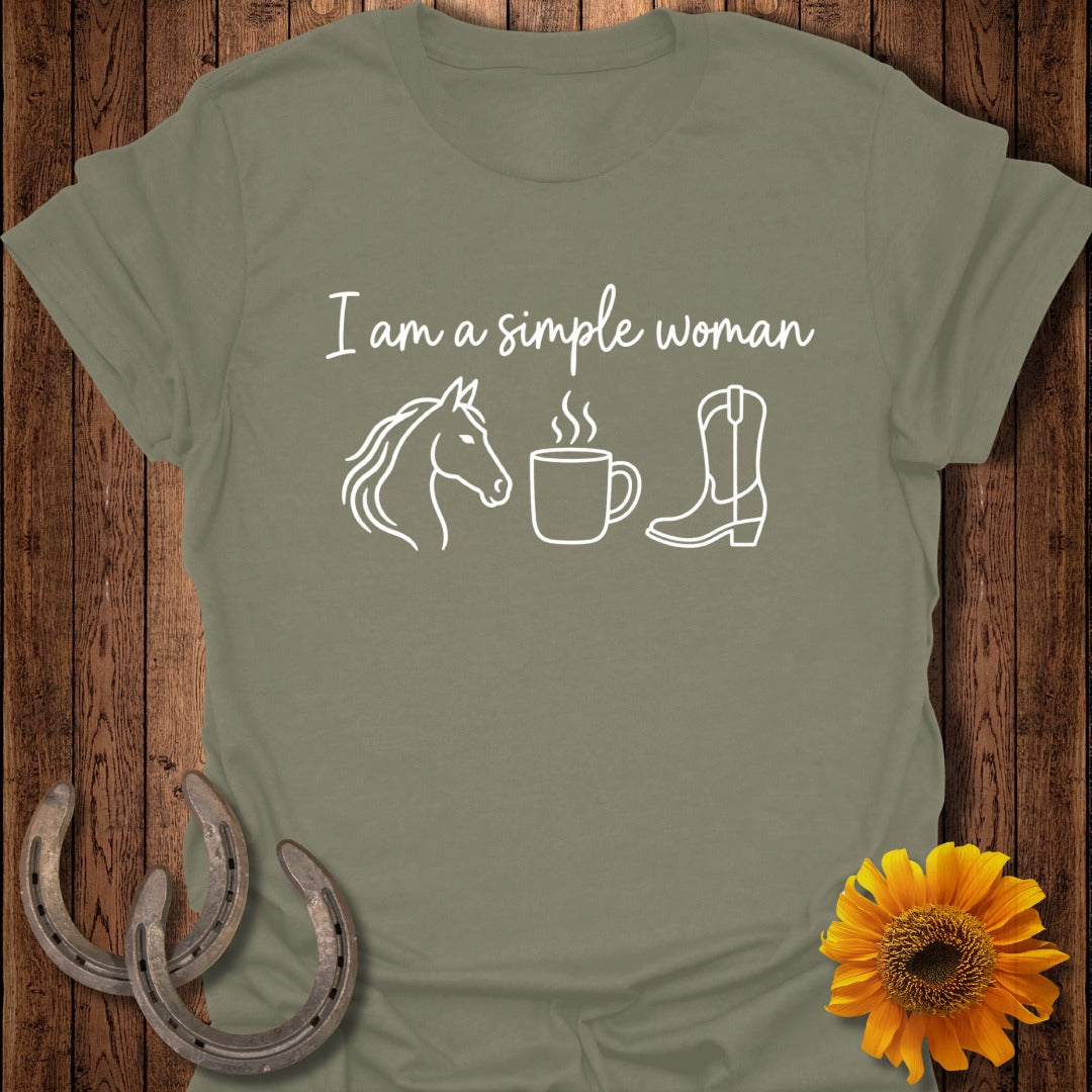 An olive green t-shirt with white text reading I am a simple woman alongside horse, coffee, and boot graphics.