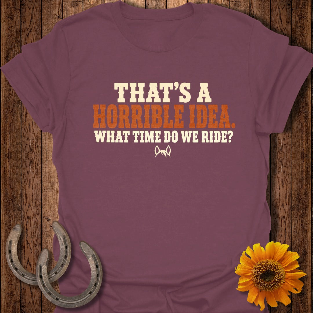 Maroon t-shirt with the text "THAT’S A HORRIBLE IDEA. WHAT TIME DO WE RIDE?" and horse ears.