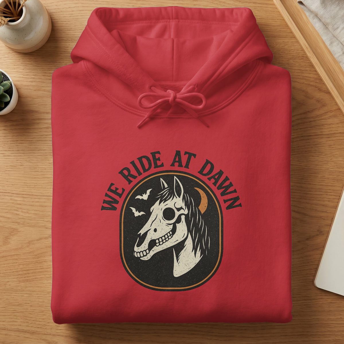 Red hoodie with a graphic of a horse skull, bats, and moon.