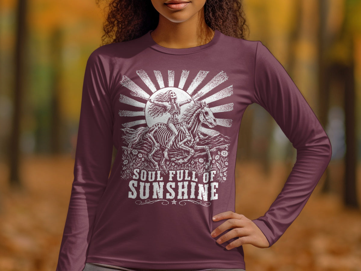 Long sleeve shirt with skeleton riding horse and text "Soul Full of Sunshine."