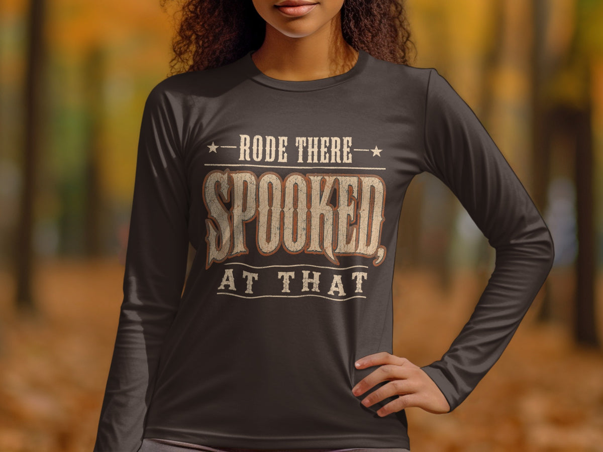 Dark long-sleeve shirt with text "RODE THERE SPOOKED, AT THAT"
