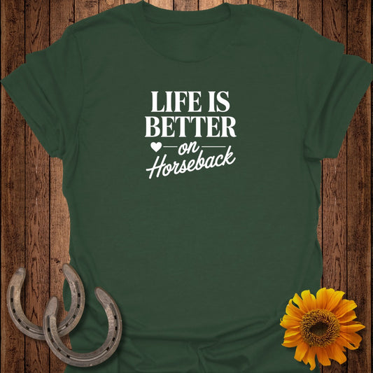 Green t-shirt with "Life is Better on Horseback" text, horseshoes, and sunflower.