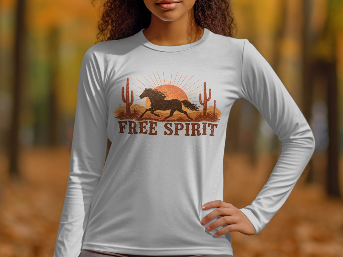 White long-sleeve shirt with running horse, desert, sun, and "FREE SPIRIT" text.