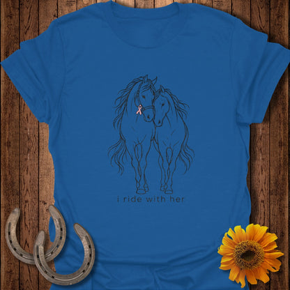 Blue t-shirt with sketch of two horses and pink ribbon, text "i ride with her."