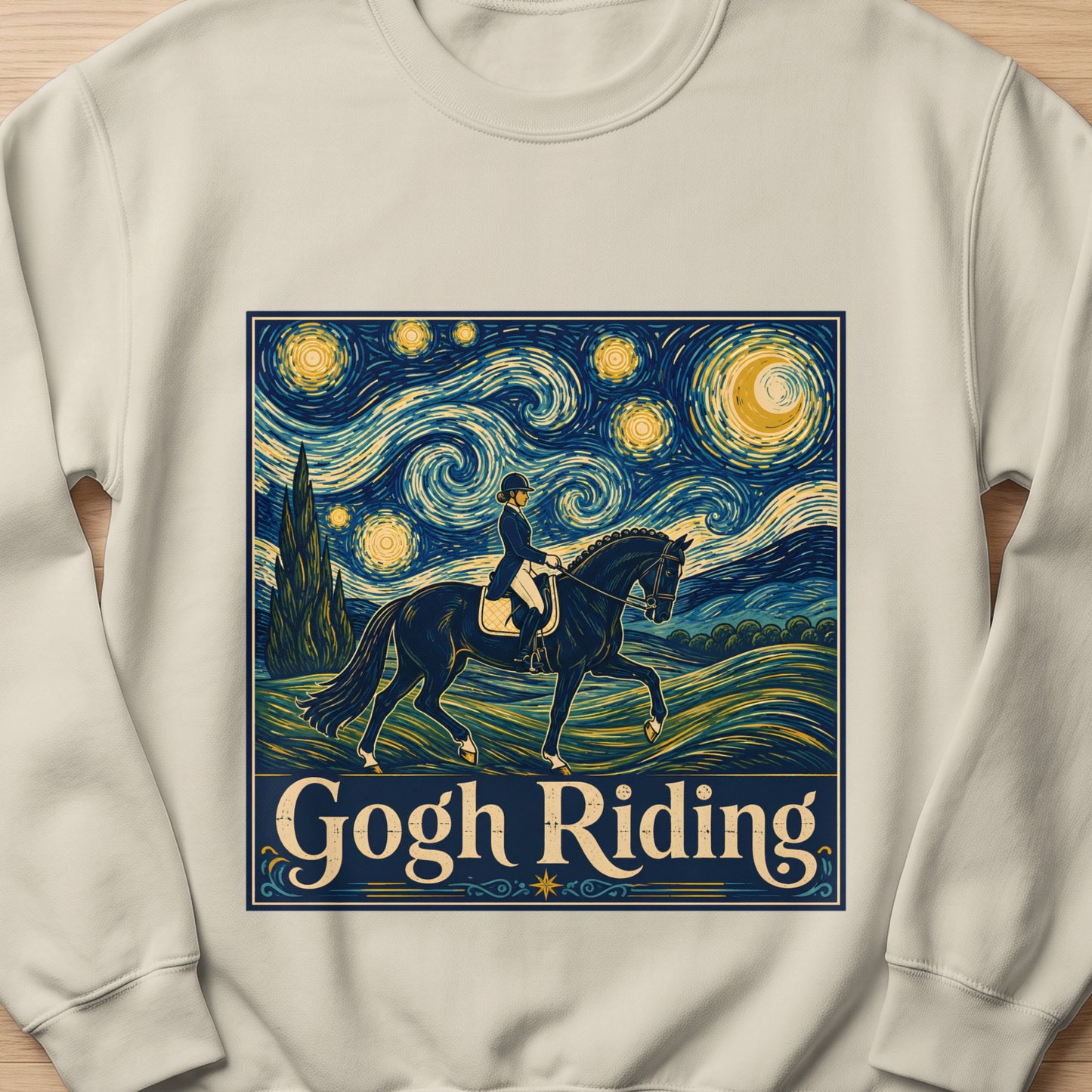 "Gogh Riding" text overlaying equestrian art in Van Gogh style on a tan sweatshirt.