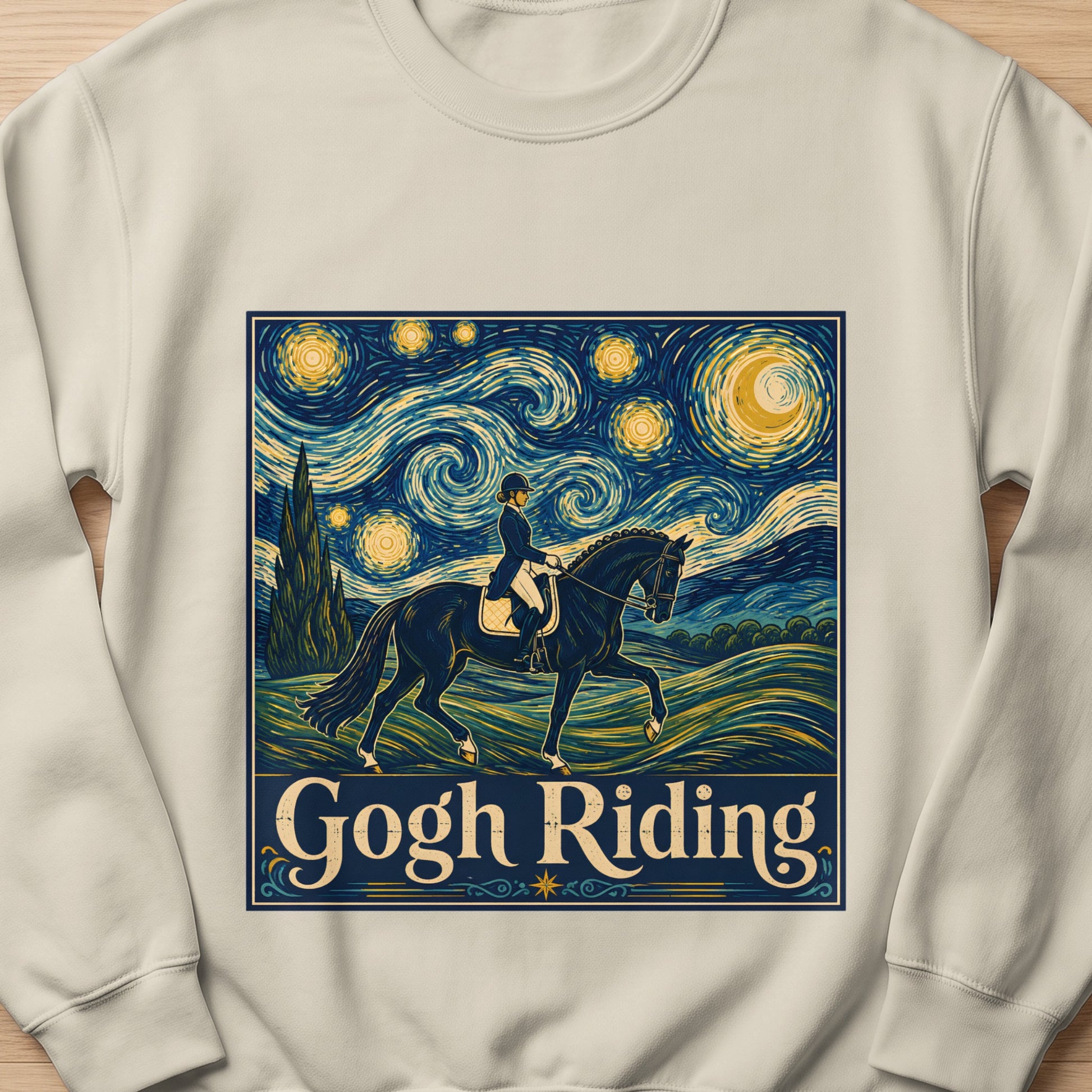 "Gogh Riding" text overlaying equestrian art in Van Gogh style on a tan sweatshirt.
