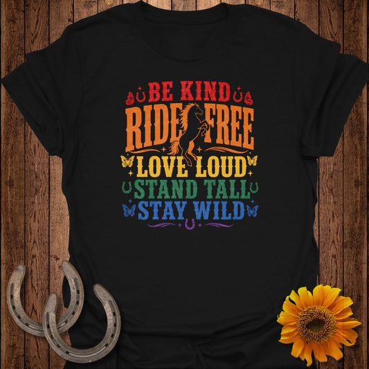 Black t-shirt with rainbow text "Be Kind, Ride Free, Love Loud, Stand Tall, Stay Wild" and horse graphic.