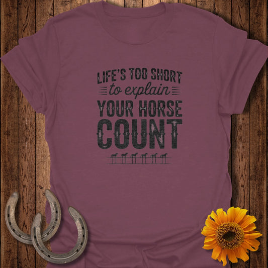 Maroon t-shirt with "Life's Too Short to Explain Your Horse Count" text and horse shoe graphic.