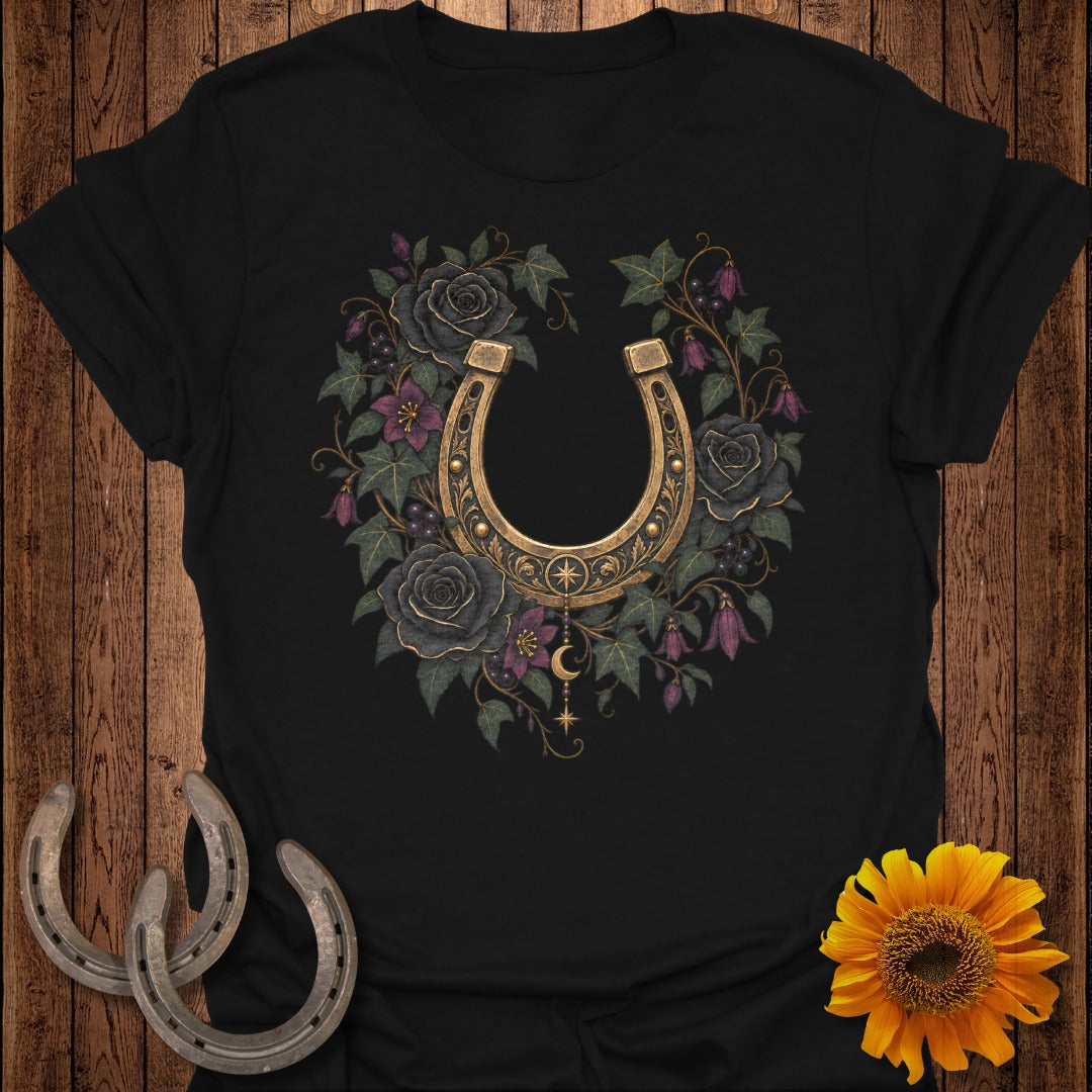 Black t-shirt with a golden horseshoe surrounded by dark roses and foliage.