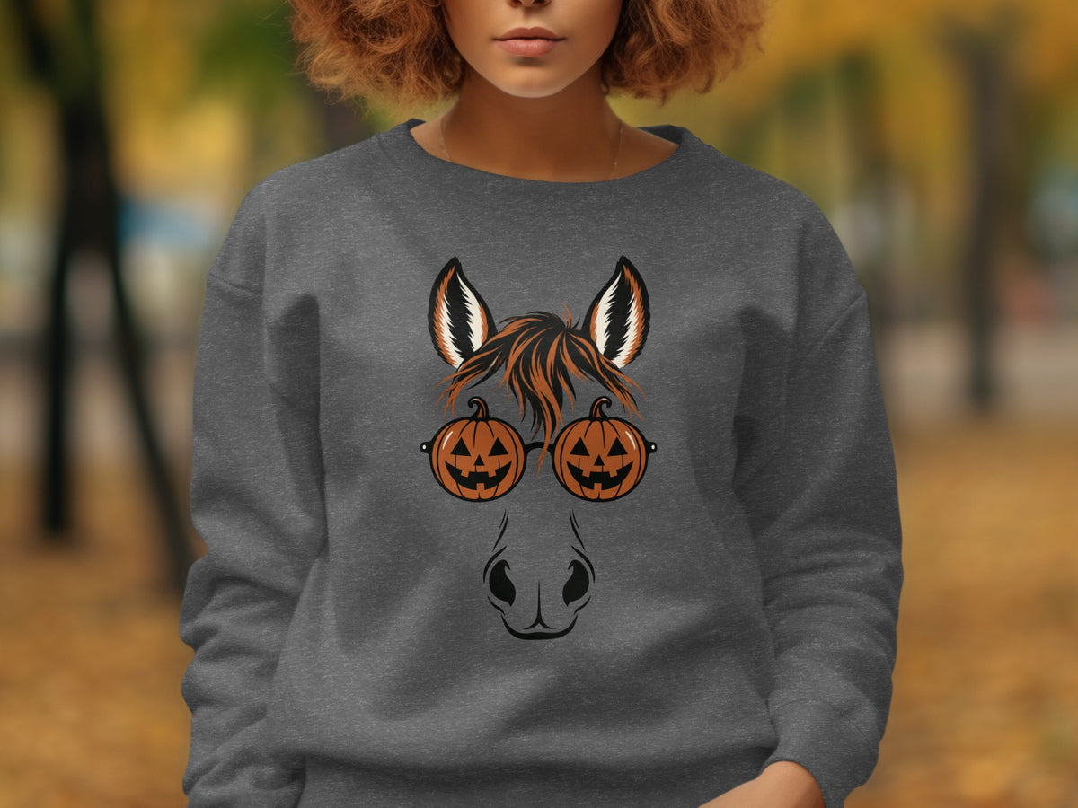 Gray sweatshirt with a horse face design featuring pumpkin glasses.