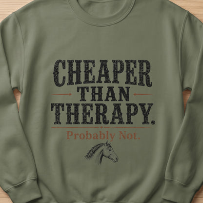 Green sweatshirt with text "CHEAPER THAN THERAPY. Probably Not." and a horse drawing.