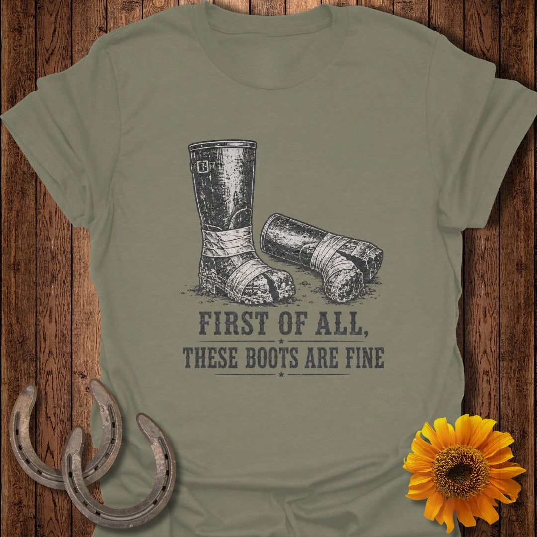 T-shirt graphic with worn boots and text "FIRST OF ALL, THESE BOOTS ARE FINE".