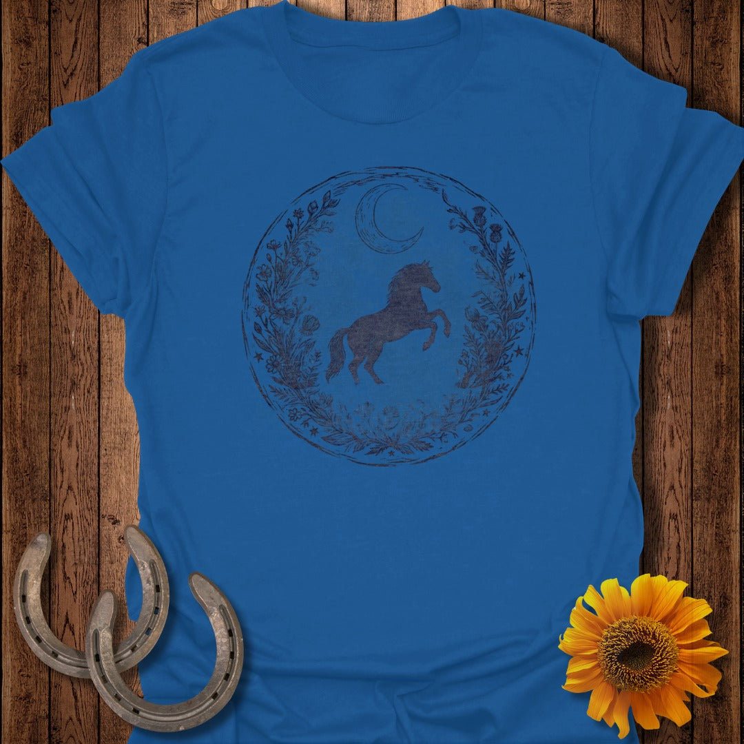 Blue t-shirt with distressed graphic of a horse within a floral and moon circle.