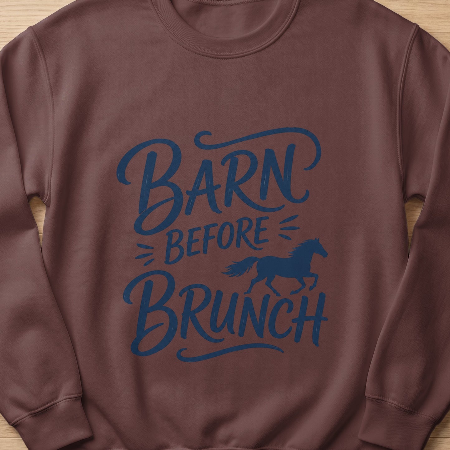 Brown sweatshirt with blue text "Barn Before Brunch" and a horse silhouette.