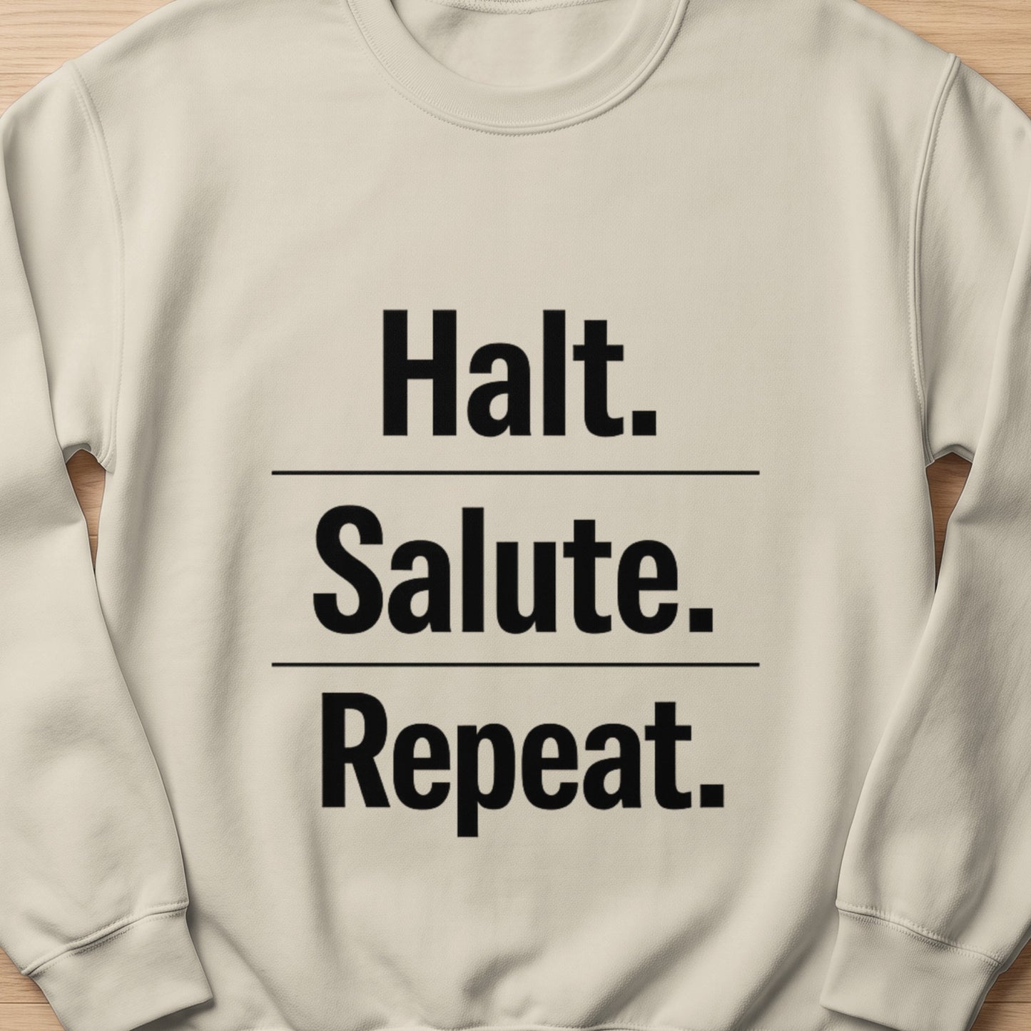 Cream sweatshirt with black text "Halt. Salute. Repeat."