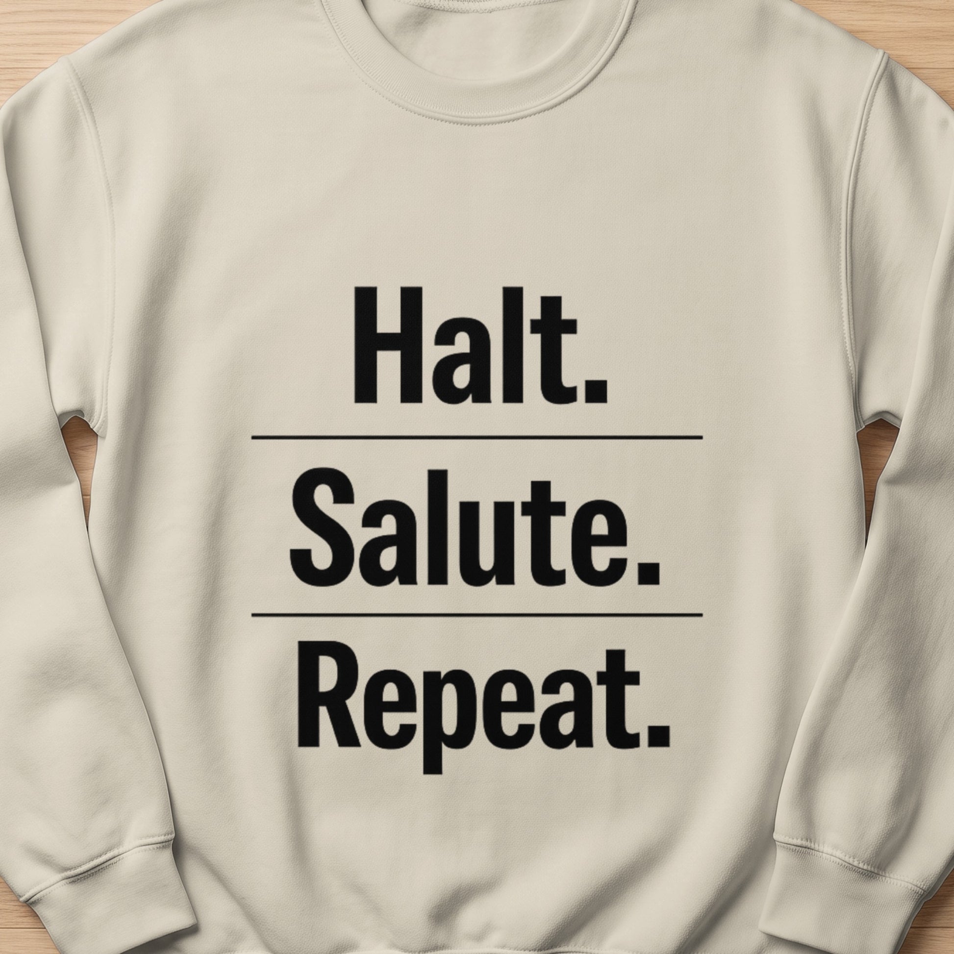 Cream sweatshirt with black text "Halt. Salute. Repeat."