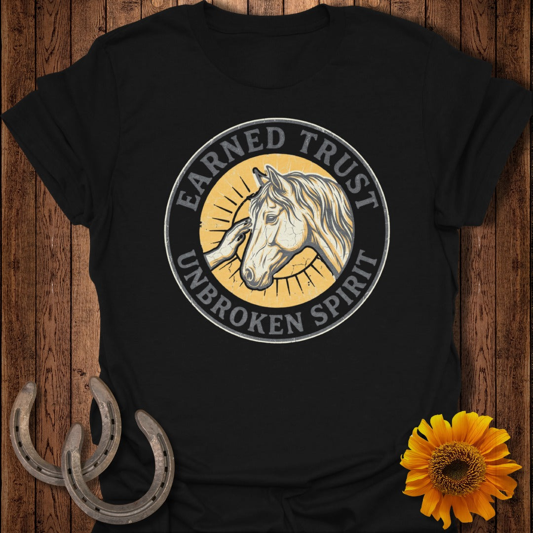 Black t-shirt with a circular graphic of a horse's head and the text "Earned Trust Unbroken Spirit".