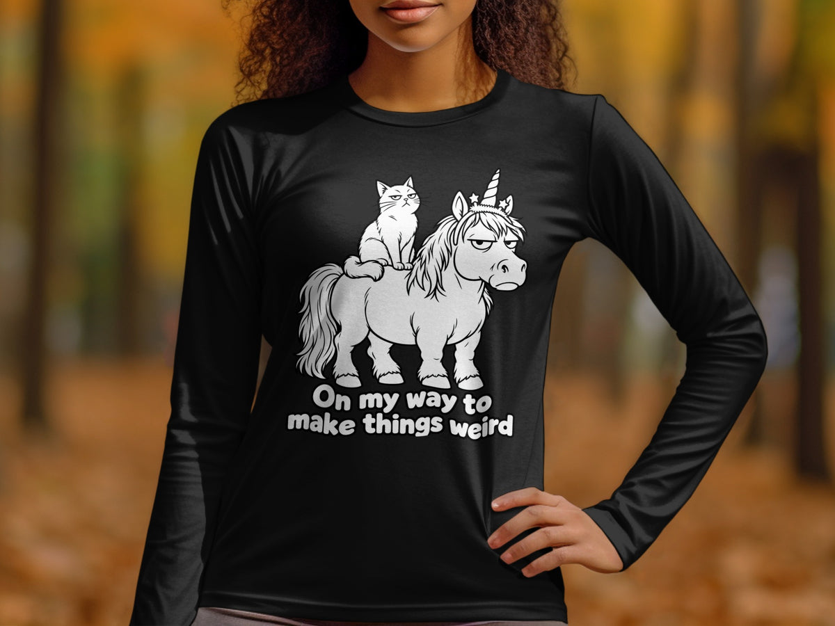 Black long sleeve shirt with a cartoon cat riding a grumpy unicorn and text.