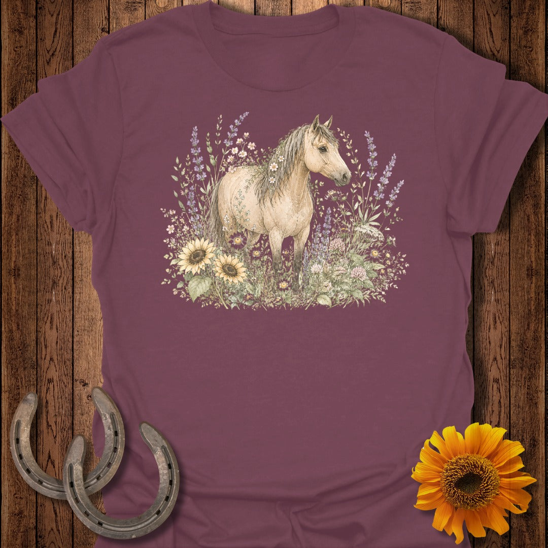 Maroon t-shirt with a light brown horse standing amongst sunflowers and lavender.