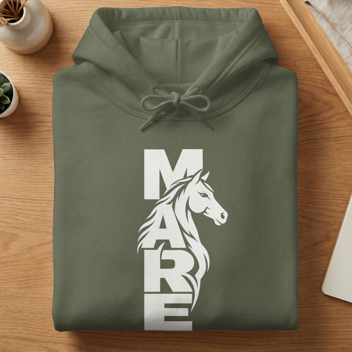 Folded olive green hoodie with a white vertical graphic spelling MARE alongside a horse head.