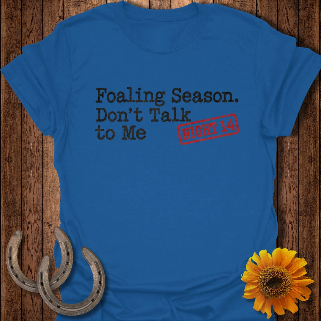 Blue t-shirt with "Foaling Season. Don't Talk to Me" text and red "NIGHT 14" stamp.