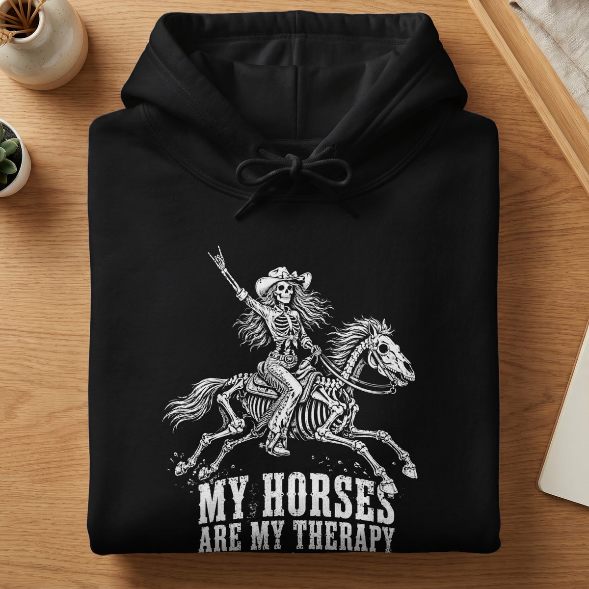 Black hoodie with skeleton rider on skeleton horse and text "MY HORSES ARE MY THERAPY".