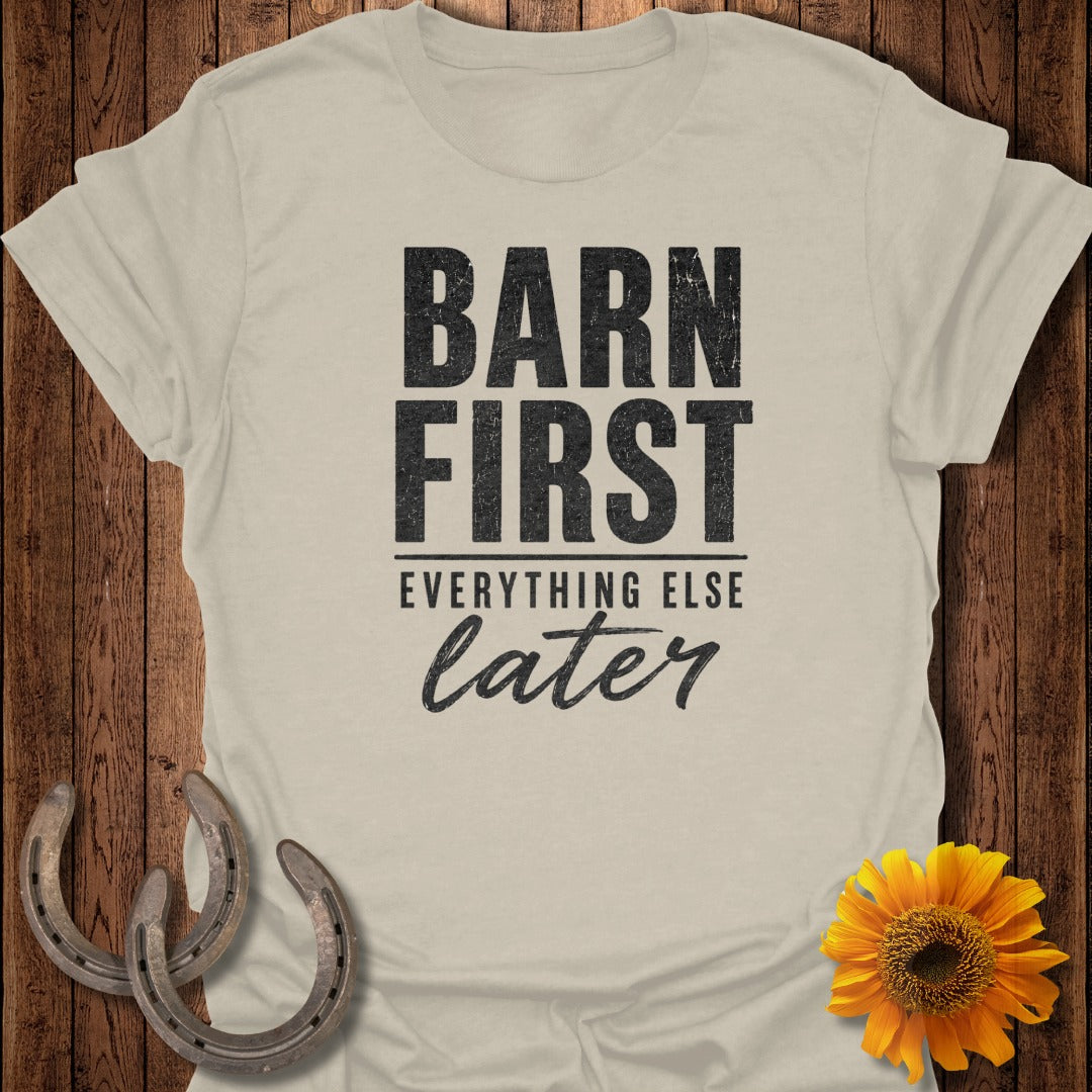 Cream t-shirt with "Barn First, Everything Else Later" text, horseshoes, and sunflower.