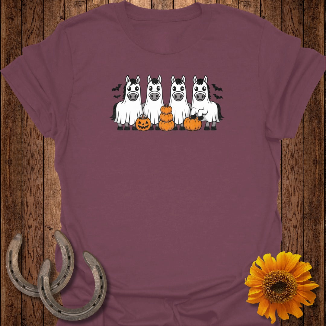 Four horses in ghost costumes with pumpkins and bats, Halloween theme.