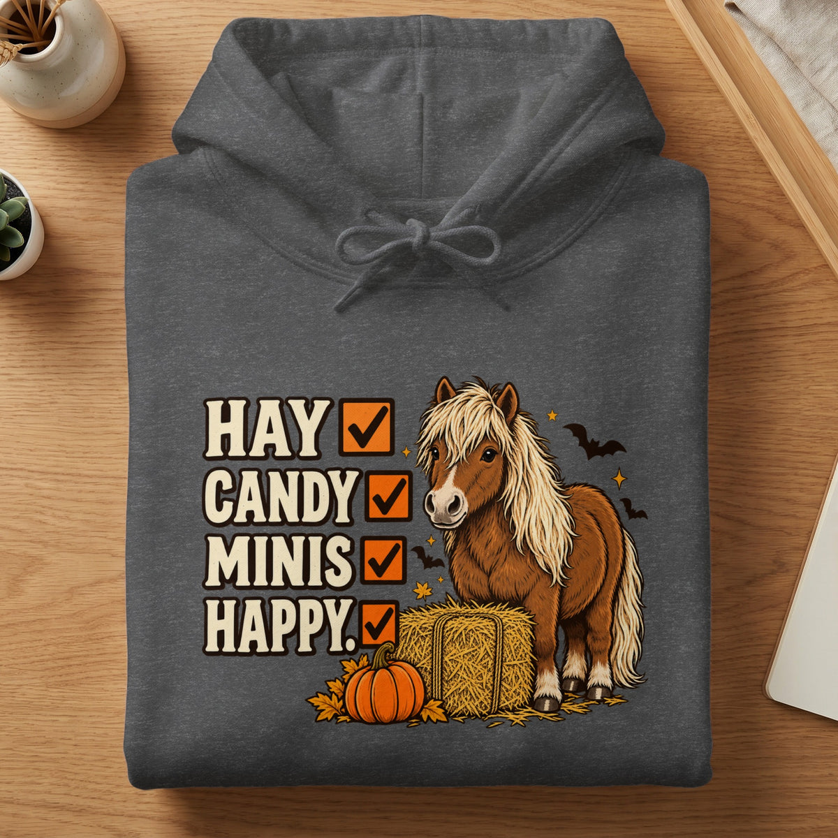 Dark gray hoodie with "Hay Candy Minis Happy" text and a pony Halloween graphic.