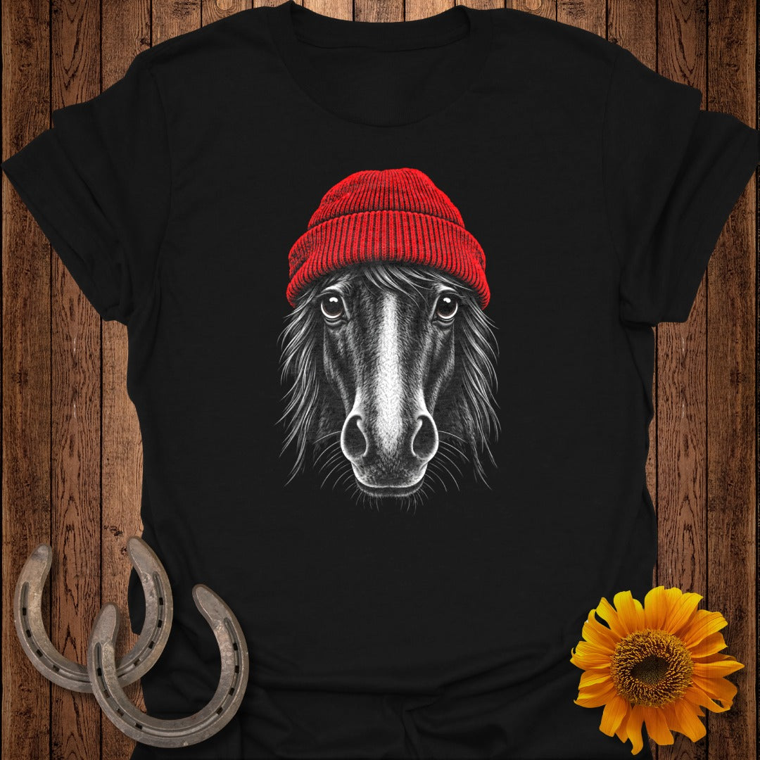 Black t-shirt with a drawing of a black horse wearing a red beanie.
