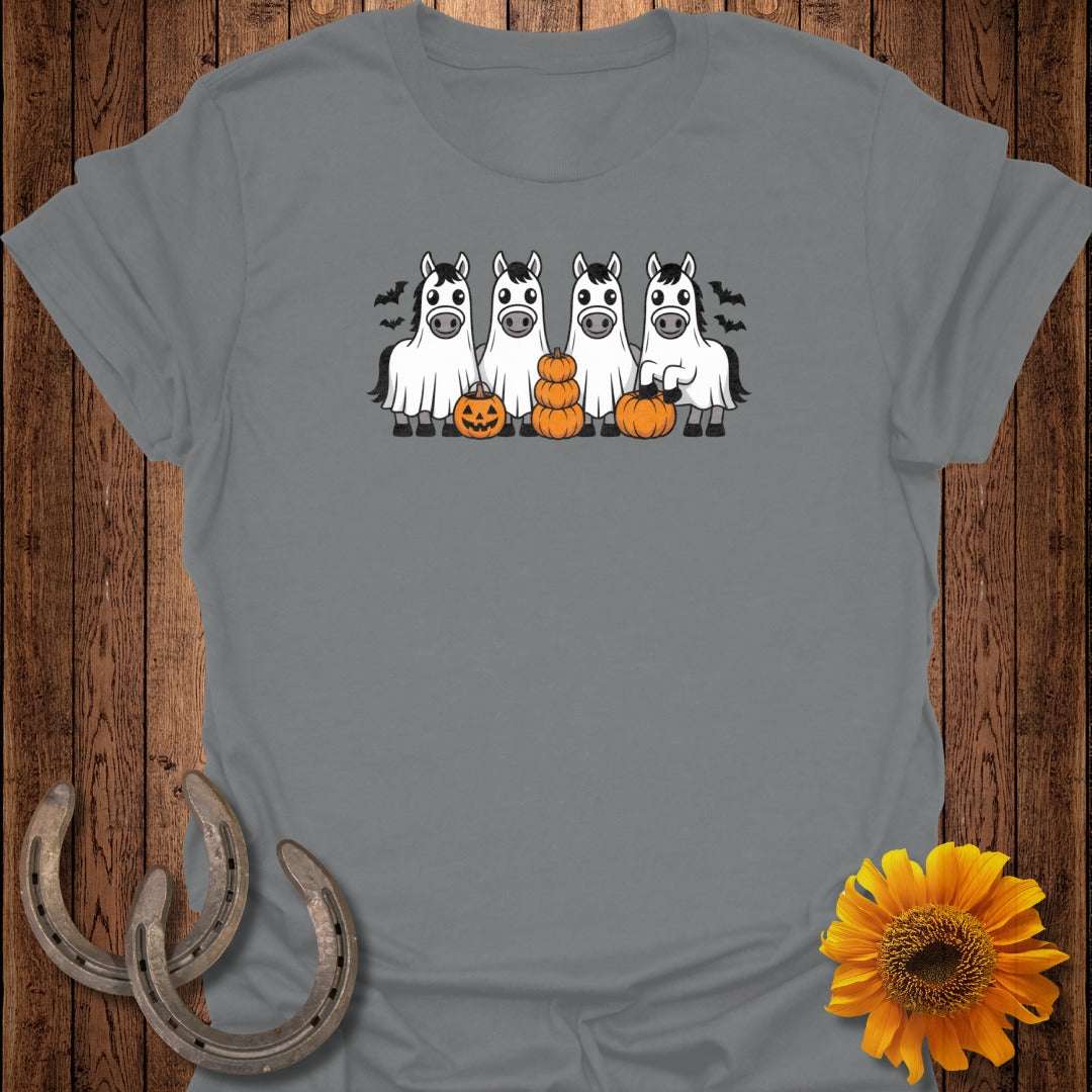 Four horses dressed as ghosts with pumpkins and bats for Halloween.