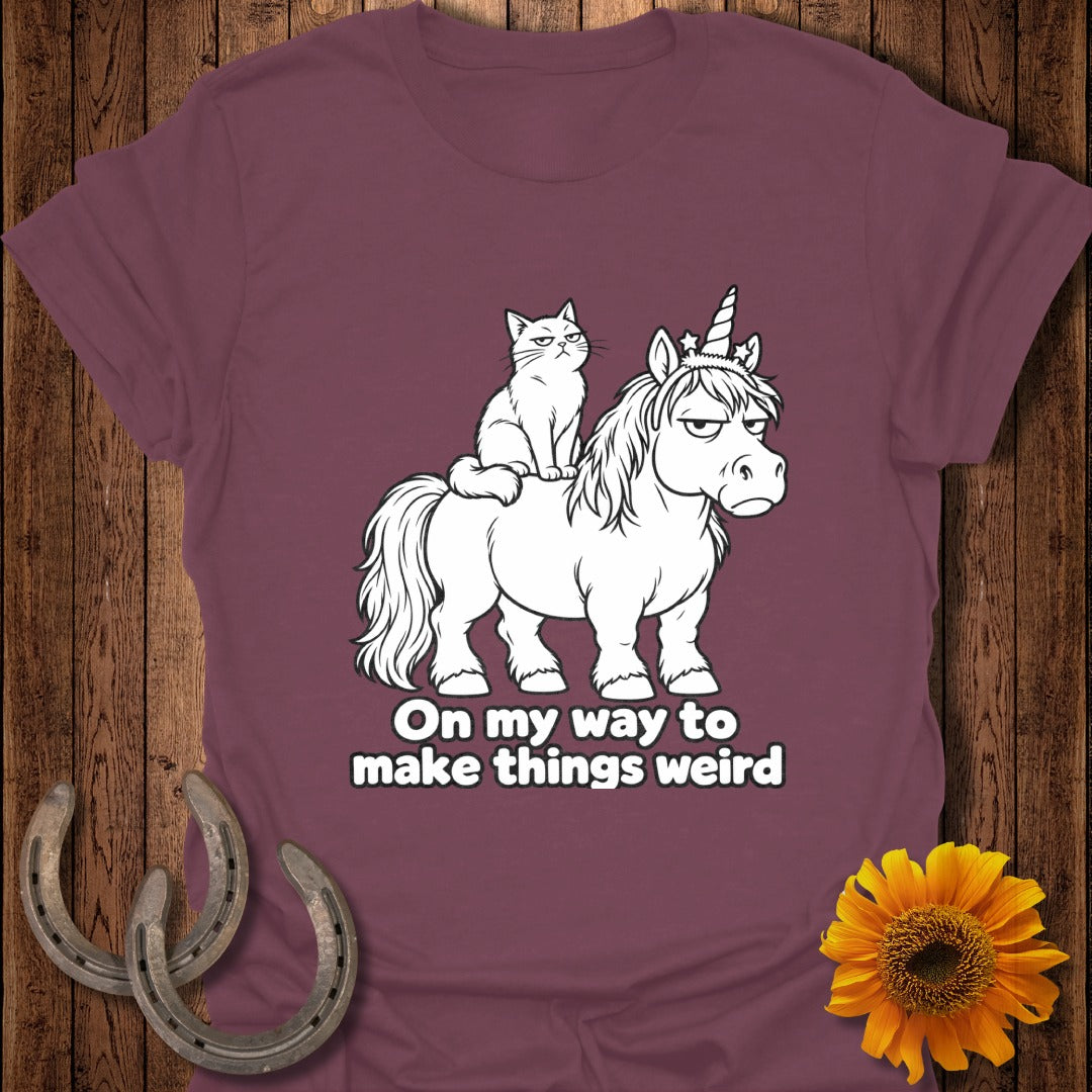 Maroon t-shirt featuring a grumpy cat sitting on a grumpy unicorn with the text On my way to make things weird.