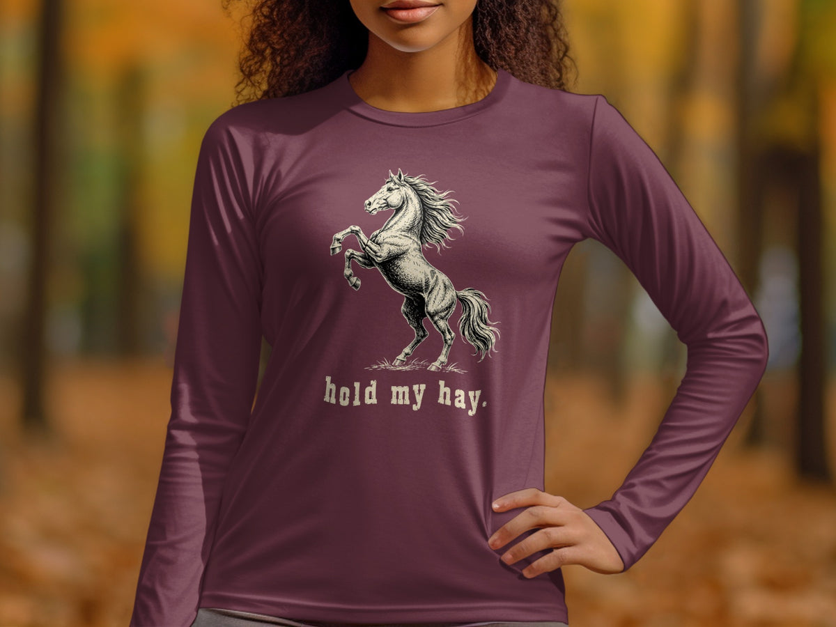 Long sleeve shirt with a rearing horse graphic and "hold my hay." text.