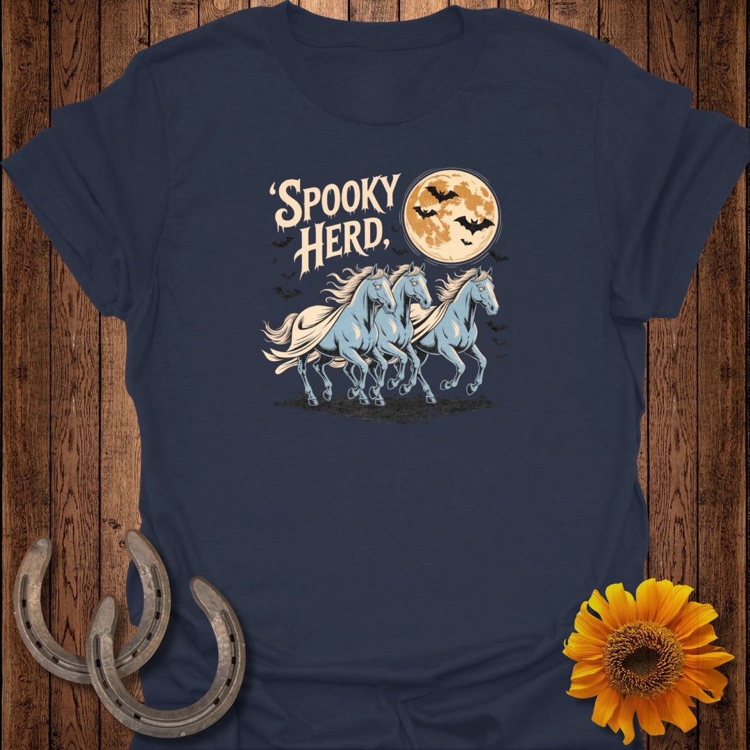 Navy t-shirt with "Spooky Herd" text, three blue horses, and bats against a moon.