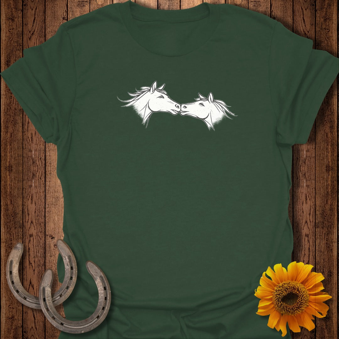 Dark green t-shirt with white outline drawing of two horses kissing.