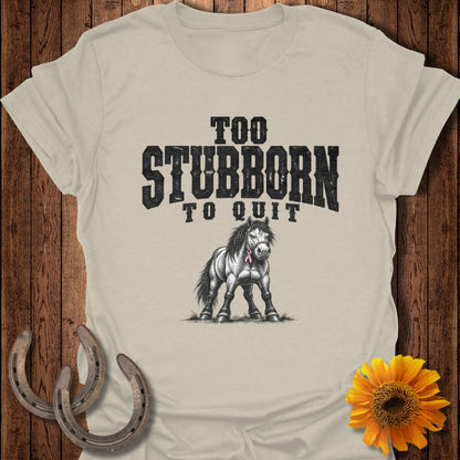 T-shirt graphic with text "TOO STUBBORN TO QUIT" above a drawing of a horse.
