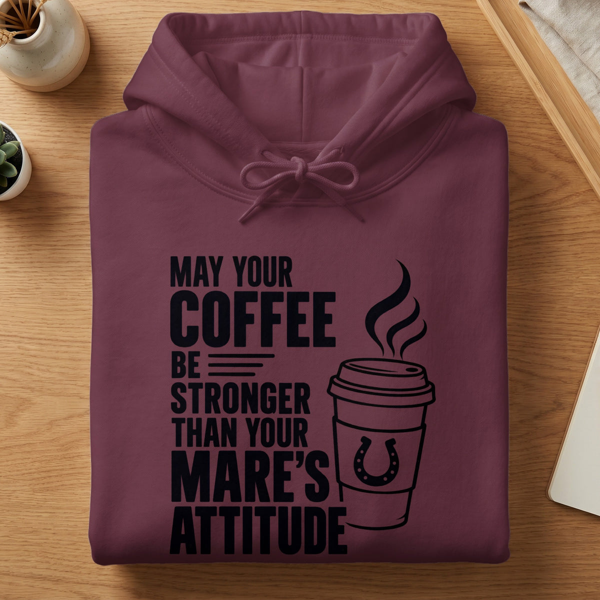 Maroon hoodie with "May your coffee be stronger than your mare's attitude" text and coffee cup graphic.