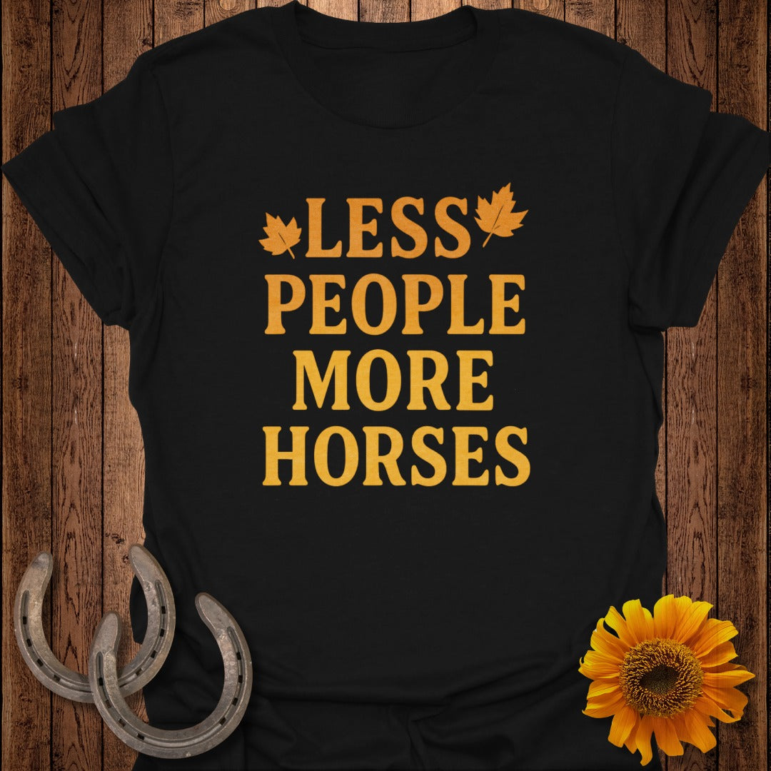 Black t-shirt with orange text reading "LESS PEOPLE MORE HORSES" with leaf accents.