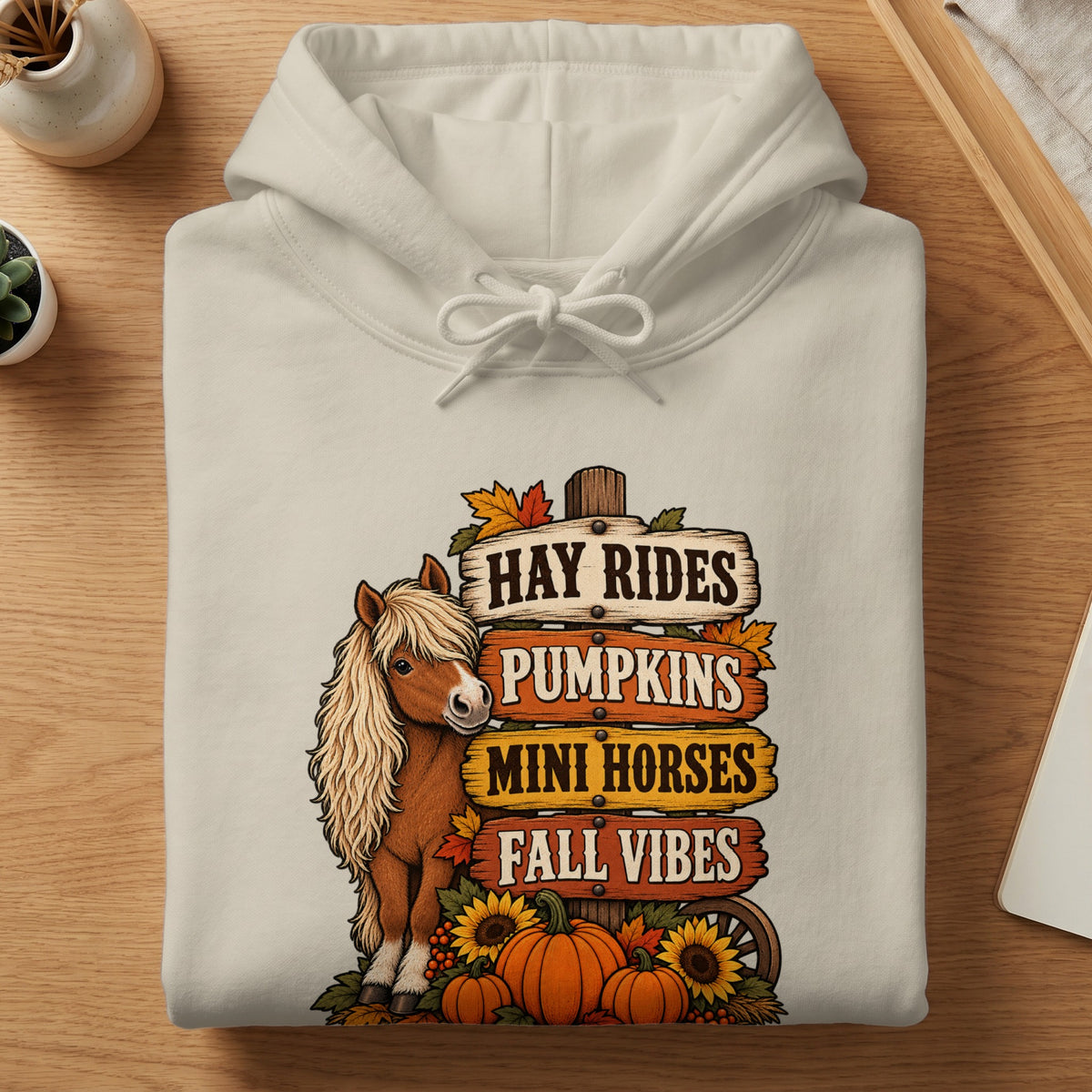 Cream hoodie with mini horse, pumpkins, and fall signs.