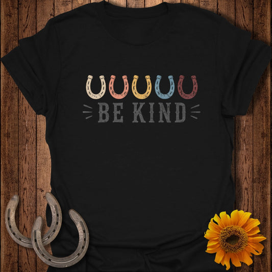 Black t-shirt with colorful horseshoes and "BE KIND" text.