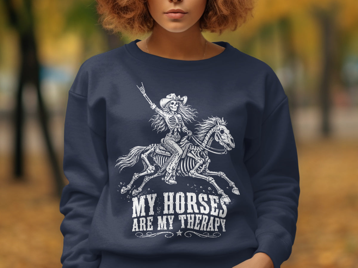 Skeleton rider on a horse with text "MY HORSES ARE MY THERAPY" on a navy sweatshirt.