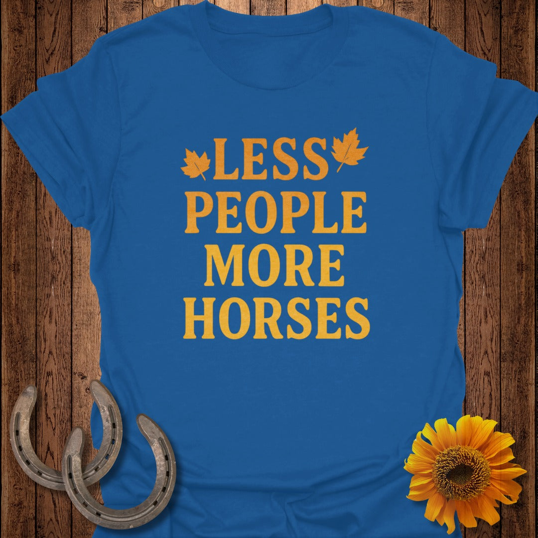 Blue t-shirt with orange text "LESS PEOPLE MORE HORSES" and autumn leaves.