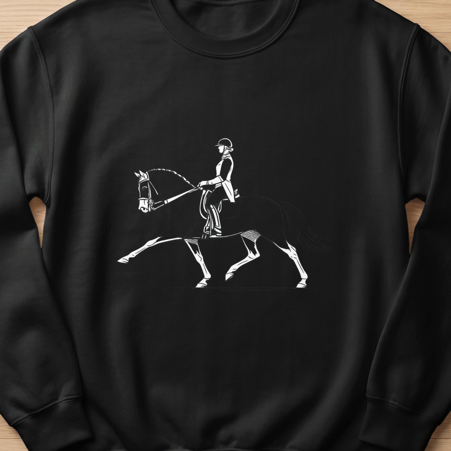 Black sweatshirt with a white line drawing of a dressage rider and horse.