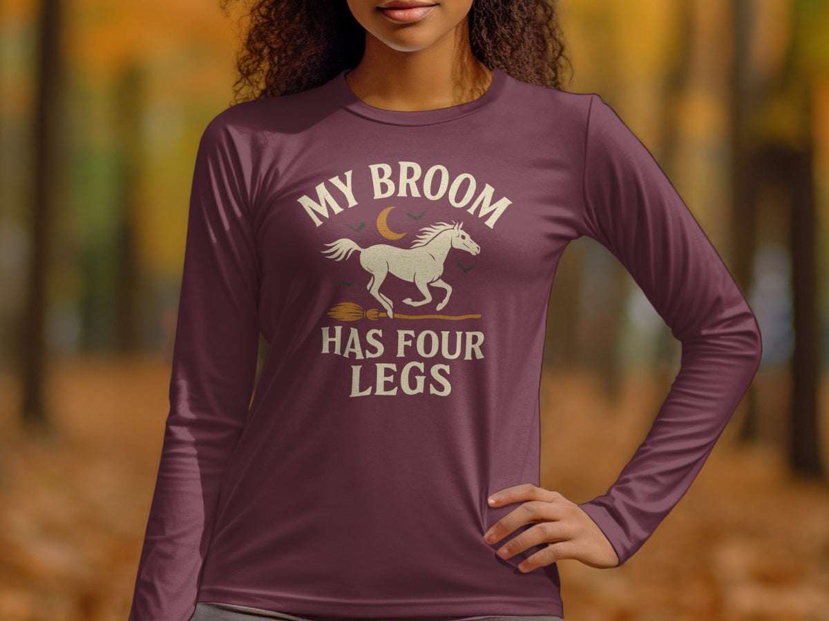 Long sleeve shirt with text "My Broom Has Four Legs" and horse graphic.