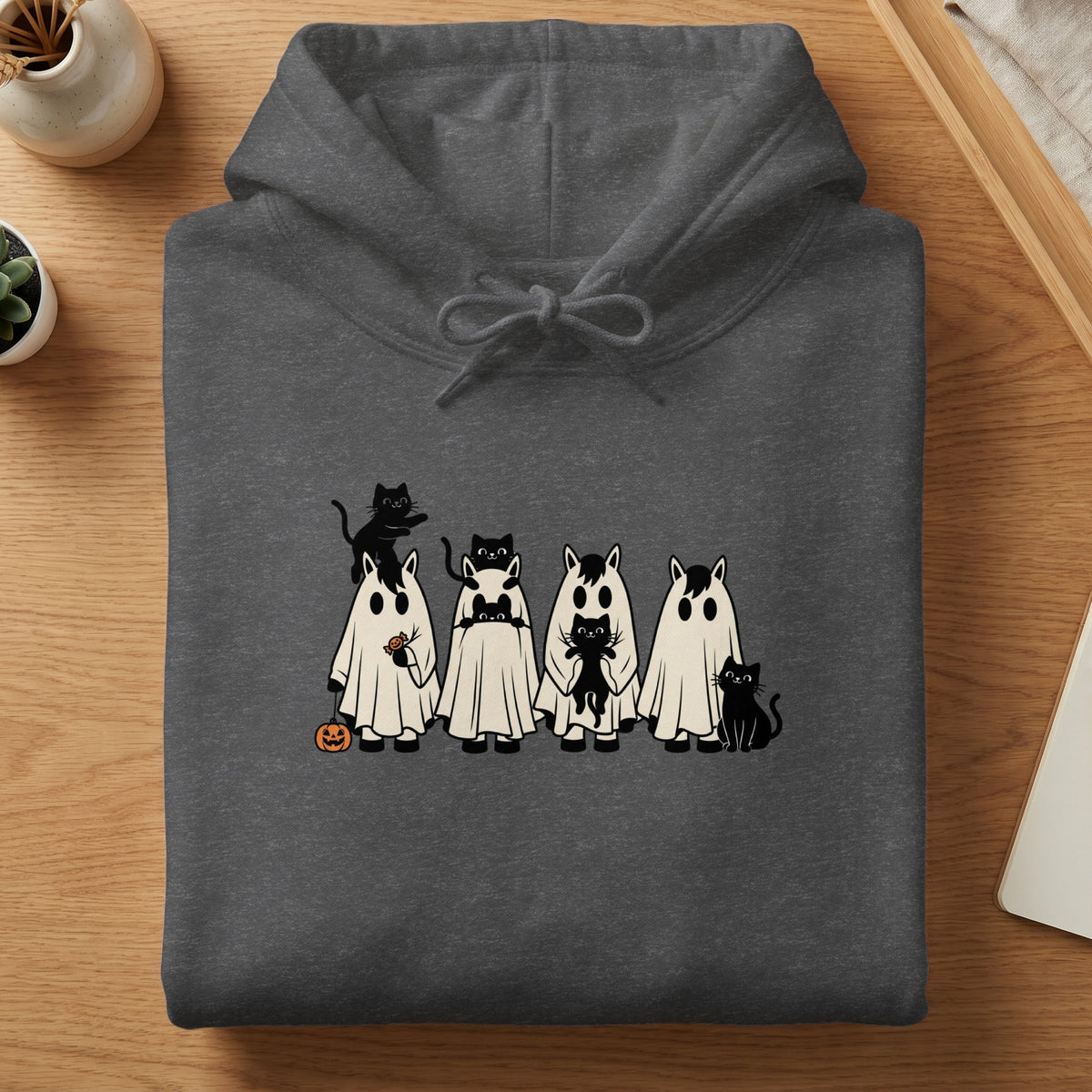 Dark gray hoodie with a Halloween-themed print of horses in ghost costumes and black cats.