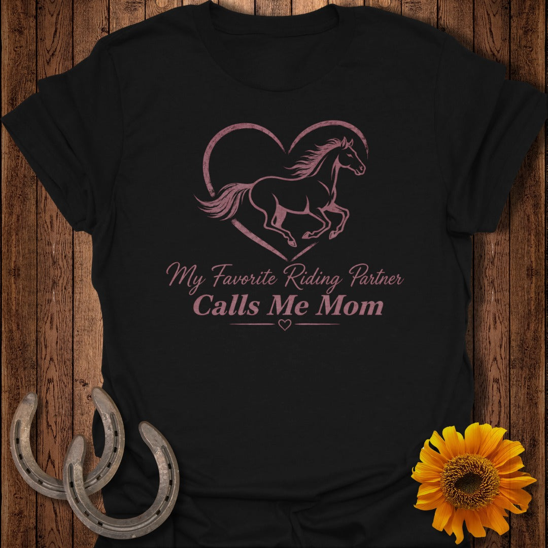 Black t-shirt with pink horse inside a heart and text "My Favorite Riding Partner Calls Me Mom".
