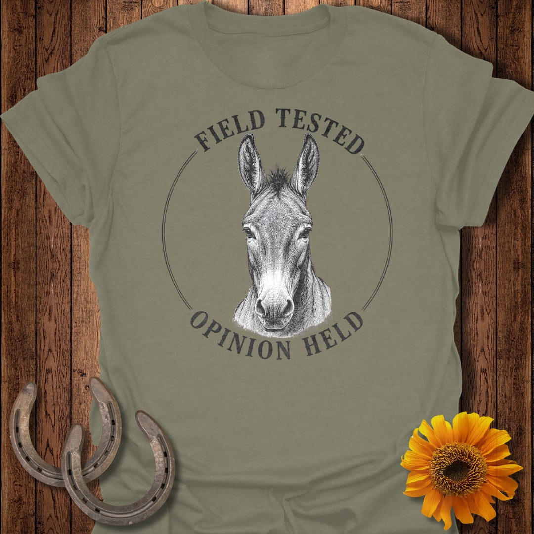 Olive t-shirt with a drawing of a mule's head and text "FIELD TESTED OPINION HELD".