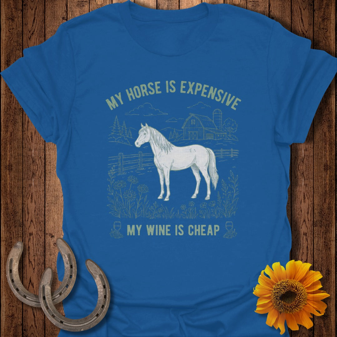 Blue t-shirt with white horse illustration and text: My horse is expensive, my wine is cheap.