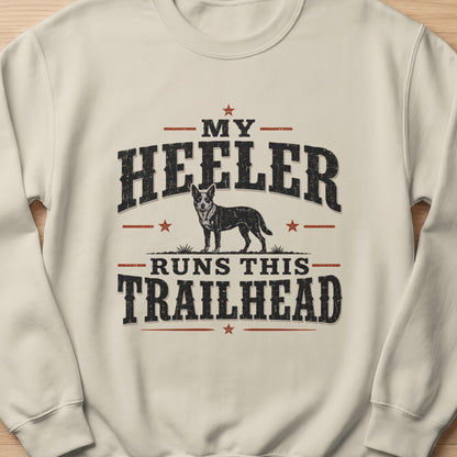 Cream sweatshirt with distressed text and a dog graphic: "MY HEELER RUNS THIS TRAILHEAD"